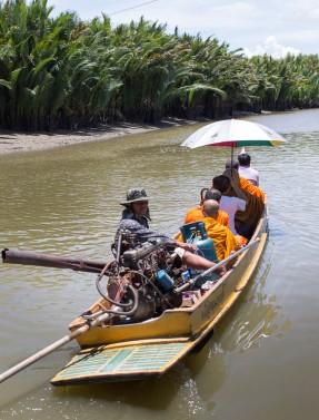 Some of the monks and Bongkot heading out on a canal on a longboat.